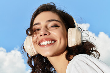 Pretty young woman enjoying summer outdoors under a bright blue sky