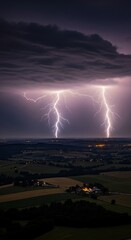 Powerful lightning illuminates a rural landscape at night.