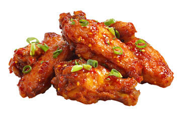 A pile of spicy buffalo chicken wings covered in sauce and garnished with scallions on transparent background
