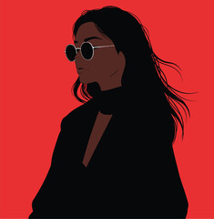 Woman with long dark hair wearing round sunglasses and black clothing against a red background female