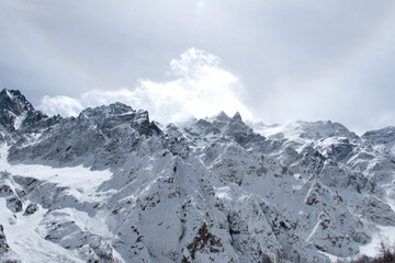 Panorama of a beautiful mountain landscape against the background of white clouds