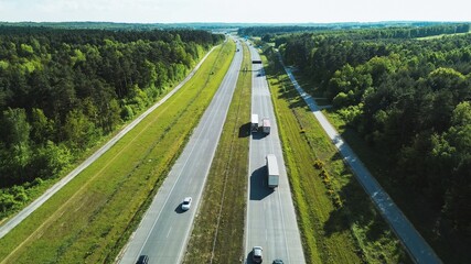 Cars on expressway in green environment © AlexGo