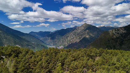 A beautiful mountain range with trees in the foreground