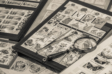 Postage stamps. Collection of stamps and magnifying glass. Collection of world stamps in a stack...