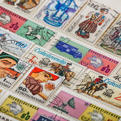 Postage stamps.A collection of world stamps in a pile.Postage stamps from different countries and...