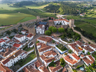 Aerial View of Historic Obidos Town with Medieval Walls and Red Tiled Roofs in Portugal