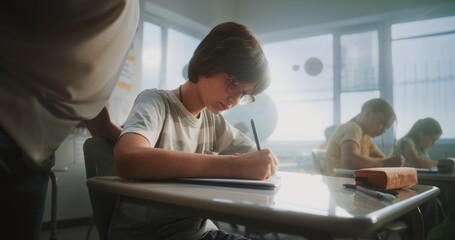 Elementary School Students Sitting and Writing Exam on Renewable Energy Resources in Modern...