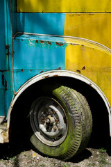 Mossy and worn tires on an old car