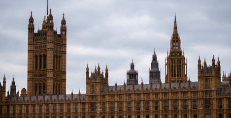 Palace of Westminster in central London on a cloudy day. Concept of government, politics, and historic British architecture near the iconic Big Ben clock tower