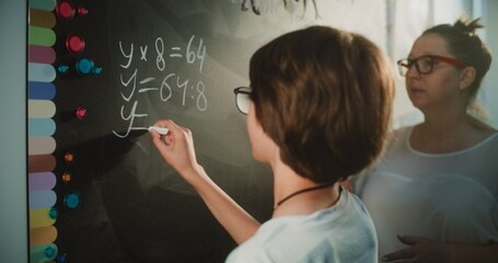 Talented Boy Demonstrating Math Knowledge: Close Up Shot of Primary School Student Solving...