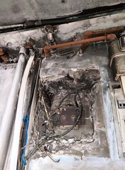 Burned electrical wiring in the house after fire
