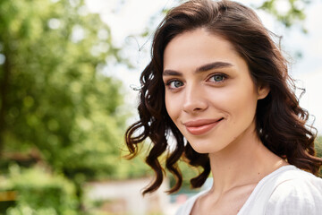 Joyful summer day with a pretty young woman in a vibrant outdoor park setting