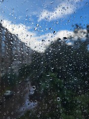 Vertical background with a window view and raindrops