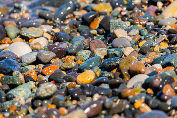 Wet pebbles on the beach