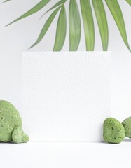 Minimalist Mockup with Palm Leaf and Green Stones. Nature Inspired Design.