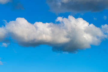 Lonely clouds against clear sky