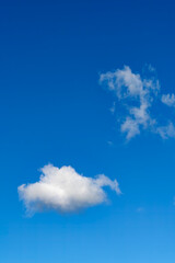 Lonely clouds against clear sky