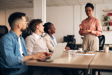 Team Collaboration and Discussion in a Modern Office Meeting Setting