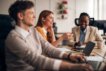 Business Team Discussing Ideas in a Modern Workspace Setting