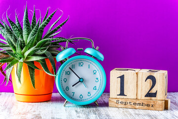 Wooden calendar with the date September 12.Monthly calendar for planning and management concept...