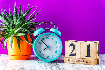 Wooden calendar with the date September 21.Monthly calendar for planning and management concept...
