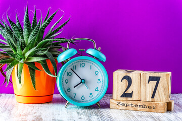 Wooden calendar with the date September 27.Monthly calendar for planning and management concept...
