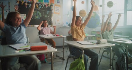 Female Teacher Conducting Funny Interactive Lesson to Primary School Children. Happy Young Boys and...
