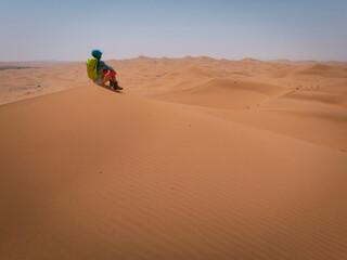 Backpacking woman hiking  in the desert
