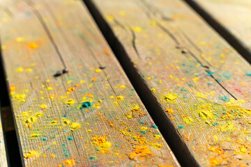 Colorful powder covering wooden planks in close-up view