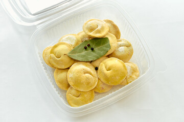Deliciously Crafted Dumplings with a Bay Leaf Garnish Showcasing the Deliciousness of Traditional Cuisine
