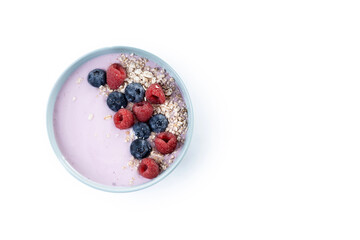 Healthy smoothie bowl with berries isolated on white background. Top view. Copy space