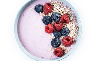 Healthy smoothie bowl with berries isolated on white background