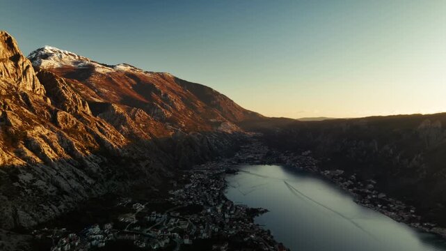 Aerial view of Boka kotor bay with cities Ljuta and Dobrota and Kotor at sunset in Montenegro