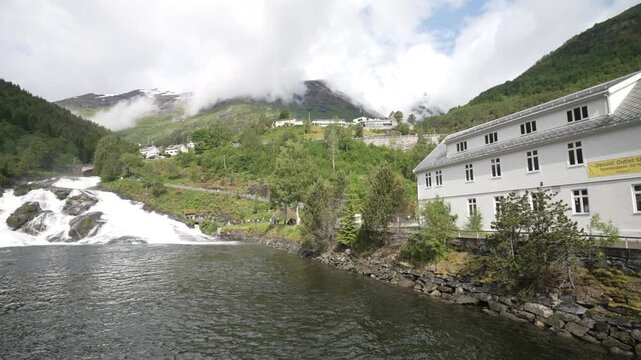 View of waterfall and church in Hellesylt, Sunnylvsfjorden, Stranda Municipality, Norway, Scandinavia, Europe