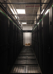 Server room corridor with metal grid floor and cabinets