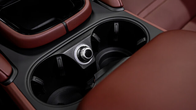 Luxurious interior, rear passenger seat made of leather with cup holders and buttons