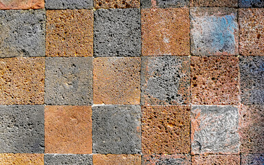 Orange checkerboard pattern wall and floor texture in Mexico.