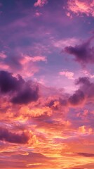 Obraz premium Sunset illuminating clouds with vivid orange, pink, and purple hues, painting dramatic landscape