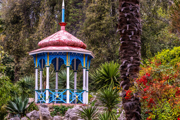 An old arbor made of wood in a park in the Crimea.