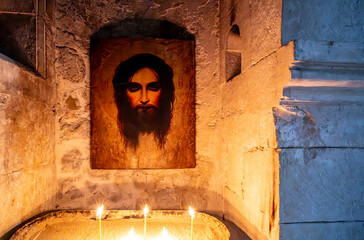 The ancient face of Christ in the monastery on the wall.