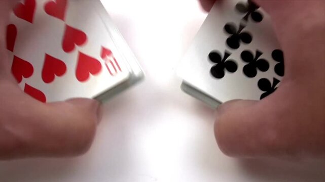 Close-Up of Skilled Hands Shuffling Two Playing Card Decks