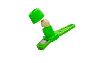 Garlic Press Tool with Clove Isolated on White Background