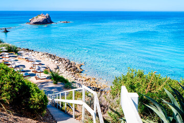 Fototapeta premium Stairs to the famous Aphrodite Beach on the Akamas Peninsula Neo Chorio near Latchi. The most beautiful places in Cyprus. The island's azure coast.