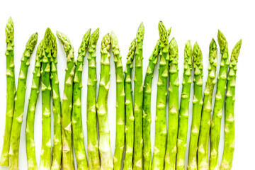Fresh raw asparagus on white background top-down