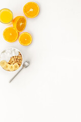 Healthy granola and orange juice for colorful breakfast on white background top view mock-up