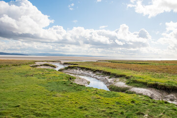 A beautiful seascape of the Grange-Over-Sands and saltmarsh beach on Morecambe Bay in Cumbria, UK.