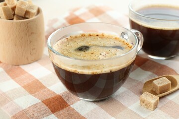 Aromatic instant coffee with sugar on table, closeup