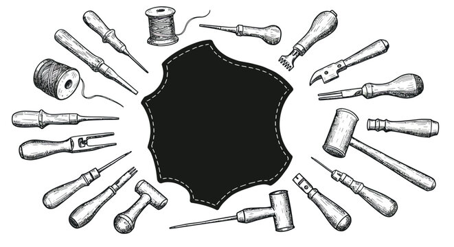 Handcrafted leatherworking tools in vintage style with blank leather piece