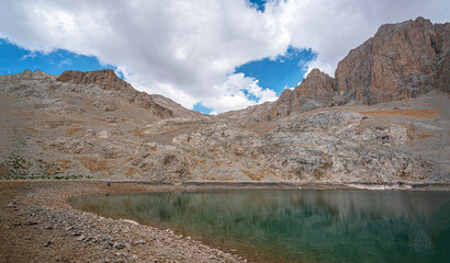 The scenic views of Demirkazık summit, Davlumbaz summit and dipsiz göl at the Aladağlar National park in Niğde, Turkey