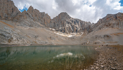 The scenic views of Demirkazık summit, Davlumbaz summit and dipsiz göl at the Aladağlar National park in Niğde, Turkey